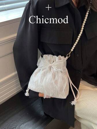 1 件时尚优雅的涤纶面料制成，带有蝴蝶结装饰抽绳开合串珠链肩带女士斜挎包，适合宴会、派对和婚礼