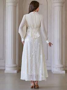 Bộ váy áo polo cổ bẻ 2 món dành cho nữ, gồm chân váy xếp ly thêu đính sequin và áo dài tay cạp cao, thích hợp cho đám cưới, tiệc chiêu đãi, liên hoan và nhiều dịp khác. - Màu be - Xem 2