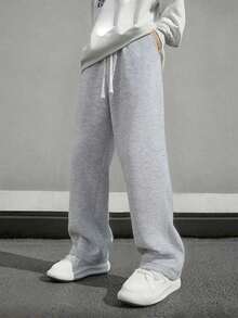 1 chiếc quần thể thao nam dáng rộng, màu trơn, ống rộng, có dây rút ở eo và túi lớn, thích hợp cho đi bộ hàng ngày, đi làm, du lịch và các dịp khác. - Màu Xám nhạt - Xem 5