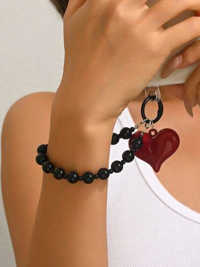 1 pieza Decoración versátil y de moda con corazón rojo y perla falsa negra, adecuada para bolsos, llaveros, pantalones, teléfonos, llaveros de pareja - una excelente opción para actividades de equipo de la empresa, regalos de fiesta, cumpleaños, Día de San Valentín