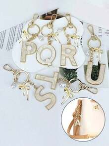 1pc 26 English Alphabet Faux Pearl Alloy Keychain Paired With Bowknot Ornaments, Popular Accessory, Backpack Charm Car Hanging Pendant Women Girls,Wallet And Handbag Accessories,Couple Pendant, Bag Pendant, Headphone Pendant,Suitable As A Family, Friends, Lovers, Mother's Day Gifts, Teacher Gifts, Birthday Gifts, Holiday Gifts - 黃金2 - 查看 3