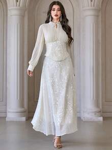 Bộ váy áo polo cổ bẻ 2 món dành cho nữ, gồm chân váy xếp ly thêu đính sequin và áo dài tay cạp cao, thích hợp cho đám cưới, tiệc chiêu đãi, liên hoan và nhiều dịp khác. - Màu be - Xem 4