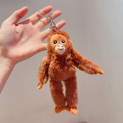 1个毛绒大猩猩钥匙扣 - 柔软的填充动物玩偶，拥有逼真的大猩猩脸部，电影主题收藏礼品，适合挂在包包、背包、车钥匙上，是完美的旅行纪念品，也可作为家居装饰品。