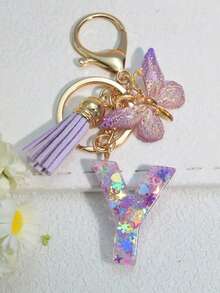Chaveiro com inicial (1 unidade), pingente de floco de neve em resina, acessório decorativo para bolsas femininas, pingente de borboleta, presente. - Roxa - Ver 29