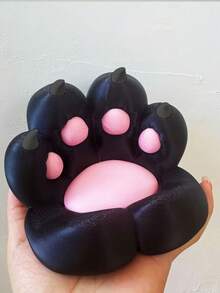 1个可爱猫爪造型桌面手机支架，色彩鲜艳，设计新颖，充电方便，防滑，适用于多种场景，包括手机支架、桌面支架、防滑塑料平板电脑支架，不含电池