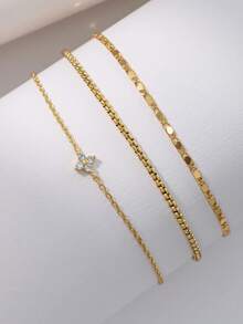 Nooxian Set de 3 tobilleras para mujer, estilo apilado bohemio para verano y playa, con trébol incrustado de cobre y circonita, cadena plana dorada electrochapada brillante, y cadena hueca delgada multicapa como accesorio de regalo - Amarillo Oro - Ver 3