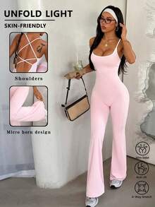 FWH 交叉露背设计，兼具收腰、提臀和丰胸功能 | 喇叭裤腿设计，拉长腿部线条，适合通勤和普拉提运动。这款女士运动连体裤采用修身交叉露背设计，内置腰部塑形功能，喇叭裤腿廓形拉长腿部线条，让您从办公室到健身房都能自信展现迷人身姿。夏季必备。 - 粉色 - 查看 3