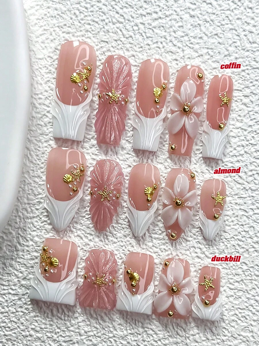 10pcs Romantic & Elegant Press-On Nail Stickers, Featuring Gold Glitter Starfish, Seashells, White Round Rhinestones, White 5-Petal Flowers Accented With Gold Rhinestones, Solid Color Water Wave Nail Art Decals, Shimmery Light Pink Nails Nail Supplies Handmade Press On Nails - 彩色 - 查看 1