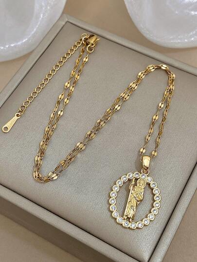 这款闪耀的金色纹理链条项链饰有圣人吊坠和锆石镶嵌。它既优雅又充满宗教气息，完美契合日常休闲风格，散发着时尚魅力。男女皆宜，是情人节的绝佳礼物。