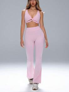 FWH 前扭结设计+可拆卸衬垫，可调节提拉效果；高腰压缩设计，采用腹部平滑技术；喇叭裤型，视觉上拉长腿部线条；#性感运动休闲 #曲线塑形 #衣橱必备；提拉喇叭裤；性感瑜伽服；提升自信的运动服，适合瑜伽和日常穿着；可调节文胸+高腰喇叭裤；惊艳交叉两件套