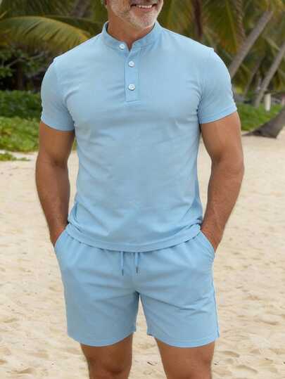 男士经典纯色立领三粒扣短袖衬衫，配有斜插口袋和抽绳短裤，休闲时尚，适合日常穿着和通勤。
