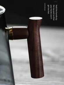 一套包含木柄玻璃茶壶、茶杯和茶具的茶具。耐热玻璃茶壶，配有优雅的玻璃内胆，方便懒人使用的茶叶分隔器，也适合篝火使用。烟灰色高硼硅玻璃茶壶套装，侧边木柄玻璃煮茶壶，户外奢华高端茶具，理想的礼品之选。 - 彩色 - 查看 7