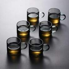 一套包含木柄玻璃茶壶、茶杯和茶具的茶具。耐热玻璃茶壶，配有优雅的玻璃内胆，方便懒人使用的茶叶分隔器，也适合篝火使用。烟灰色高硼硅玻璃茶壶套装，侧边木柄玻璃煮茶壶，户外奢华高端茶具，理想的礼品之选。 - 彩色 - 查看 15