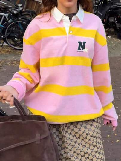 女士粉黄条纹橄榄球衫，饰有“N”字图案，宽松长袖 Polo 衫