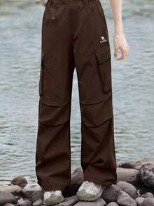 CAMEL CROWN Women's Outdoor Soft Shell Pants, Windproof Waterproof Loose Hiking Trousers - French Brown - View 1