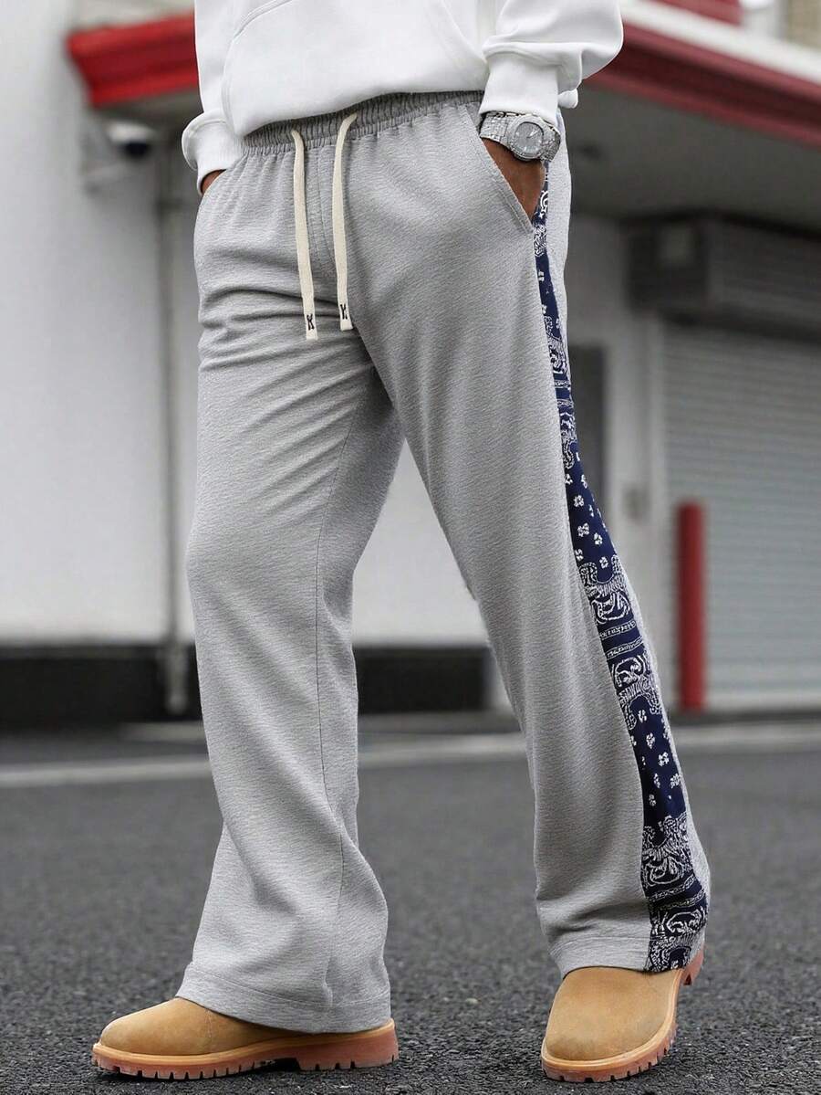 男士抽绳松紧腰宽松阔腿裤，饰有腰果花拼接细节，街头休闲运动裤，适合春秋季日常穿着、聚会和度假。 - 淺灰色 - 查看 1