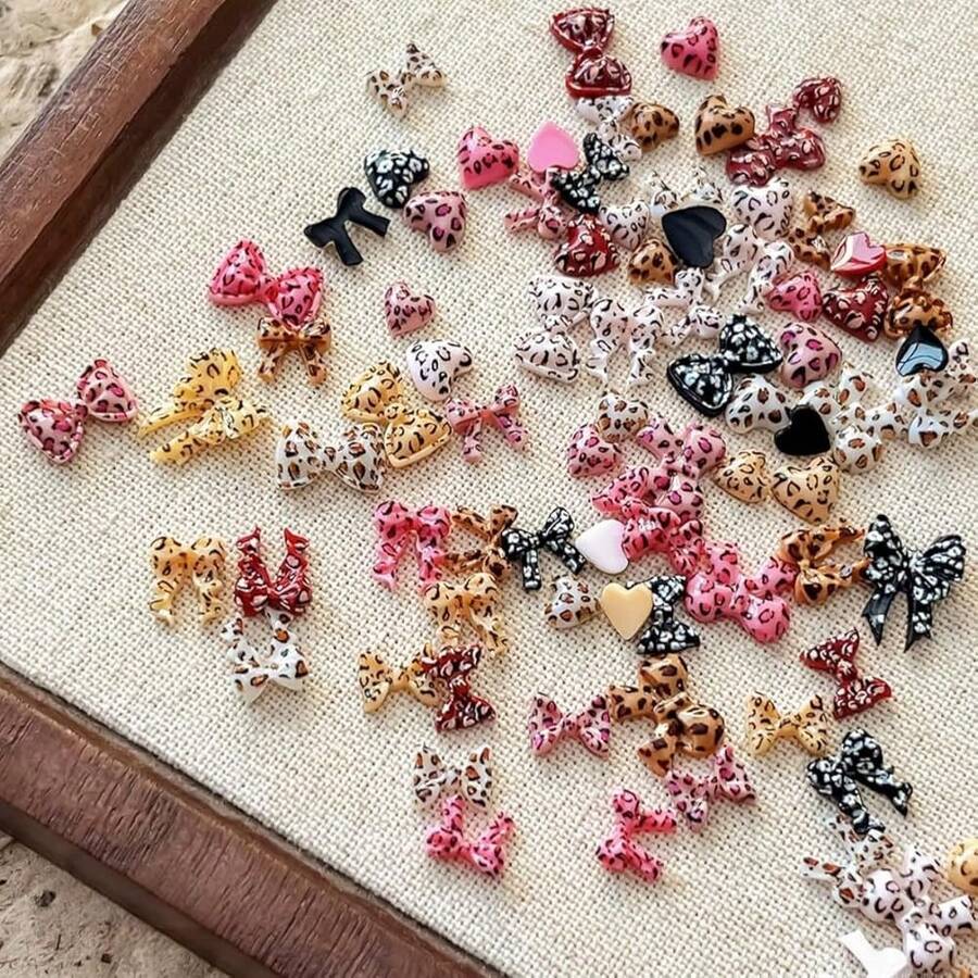 150Pcs Bow Heart Nail Art Charms Bow Nail Rhinestone With Leopard Print Designs Cute Resin Bow Nail Supplies Mini Leopard Heart Nail Gems 3D Multi Color Ribbon Bow Nail Jewelry Nail Diamonds For Women,Gray - xám - Xem 1