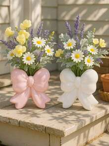 1 bình hoa trang trí màu hồng/trắng có nơ, thích hợp để trang trí bàn ăn, phòng khách. - Nhiều màu - Xem 5