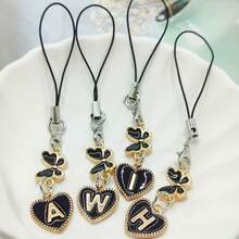 1 Stück schwarzer Legierung Herz-förmiger Anhänger mit englischen Buchstaben, zierlicher Schmetterling Handykordel, Taschenanhänger, Handykette, Schlüsselanhänger, Herren Handyzubehör, Handyanhänger, Handydekoration, geeignet als Neujahrsgeschenk, Valentinstag Geschenk, Geschenk für Freunde, Freundin, Freund, kompatibel mit Android und den meisten Smartphones, Geschenke für Mutter, Familie, Freunde, Kinder, Geburtstag, Feiertage Handykette - Schwarz - Übersicht 2