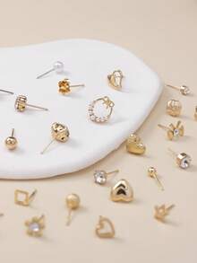 一套30对简约时尚的耳钉，饰有可爱的星星和蝴蝶结图案，款式多样。这些金属仿珍珠耳钉适合作为女士的节日礼物，也适合日常休闲佩戴。 - 金黃色 - 查看 3