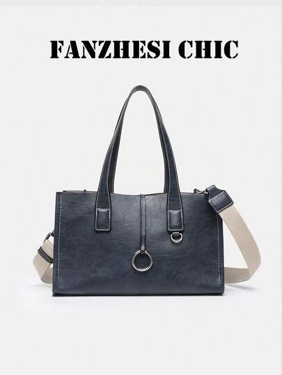 This Deep Blue Leather Handbag Features Sharp Lines And A Striking Silver Metal Ring On The Front, Making It Perfect For Various Occasions Such As Daily Commuting, Business, And Leisure.