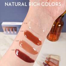 四支装润唇膏套装，四种口味，蕴含玻尿酸和维生素E，保湿丰盈，透明色，不粘腻，纯素配方，唇部护理，适合干燥唇部，日常使用。