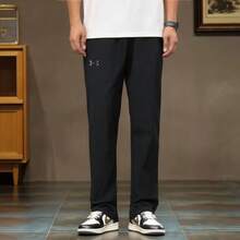 Under Armour Solid Color Drawstring Mid-Rise Casual Trousers For Men.