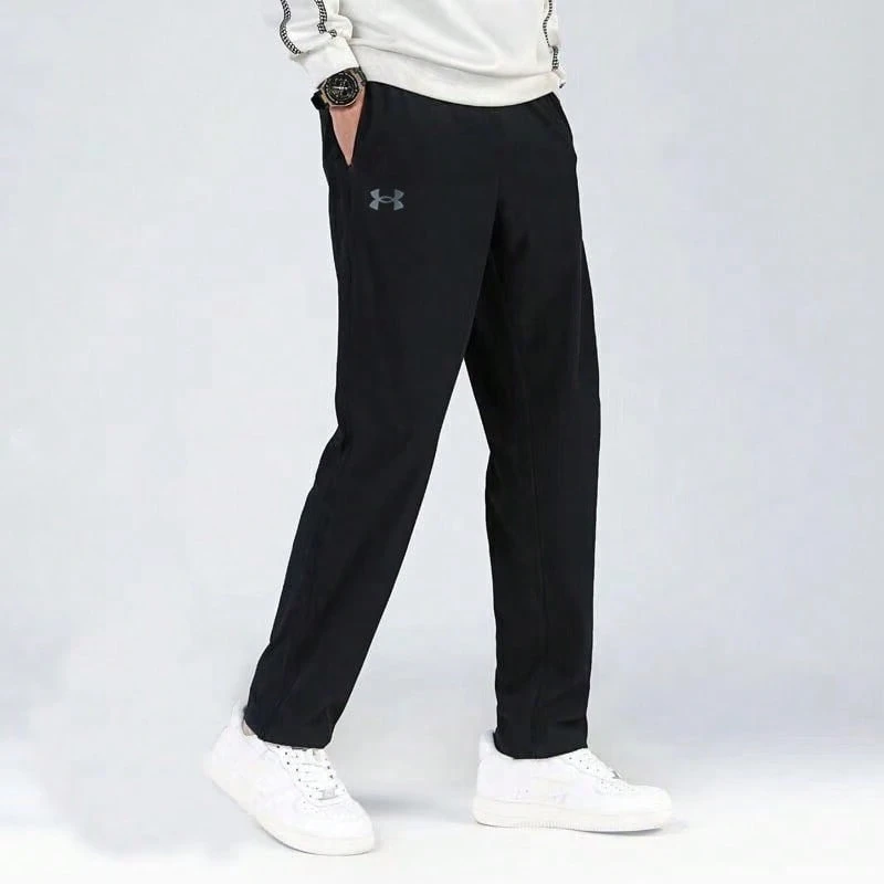 Under Armour Solid Color Drawstring Mid-Rise Casual Trousers For Men.