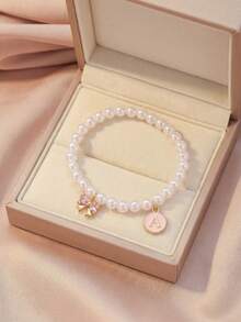 1件甜美优雅时尚密镶锆石蝴蝶结和圆形英文字母吊坠仿珍珠手链，适合儿童、女孩、家人、朋友、夏季、旅行、街头时尚，单件饰品，适合日常装饰、节日生日礼物、儿童饰品 - 粉色 - 查看 2