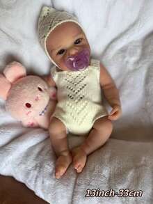 1个13英寸（约33厘米）柔软硅胶重生娃娃，名为Loulou，解剖结构精准，手工绘制，血管清晰可见，触感柔软，适合作为生日礼物或家庭聚会礼物。 - Reborn Doll - 查看 3