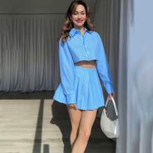 Europäische und Amerikanische Damenmode Frühling Neue Einfarbige Langarm-Mehrfachknopf-Oberteil und Kurzer Rock Set