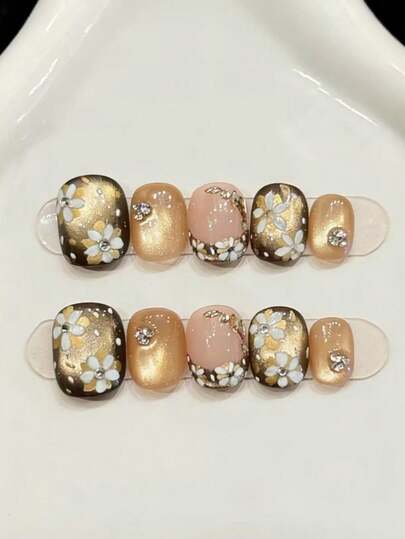 10片装短款椭圆形手工美甲贴片，适合派对和日常佩戴，金色美甲贴片，美丽的山茶花图案，椭圆形美甲贴片。闪亮耀眼，易于佩戴。10片装Y2K风格手工美甲贴片，适合女孩和女士在节日派对和日常佩戴。美甲用品。手工美甲贴片