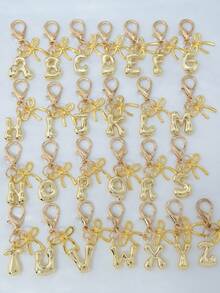 1个A-Z金色泡泡字母可爱吊坠，蝴蝶结装饰，钥匙扣，戒指托，背包挂饰，汽车挂饰，购物，海滩，露营，钱包配饰。适合作为送给女性、朋友和学生的礼物，时尚创意设计，生日礼物装饰，圣诞礼物。 - 金色蝴蝶結 - 查看 9
