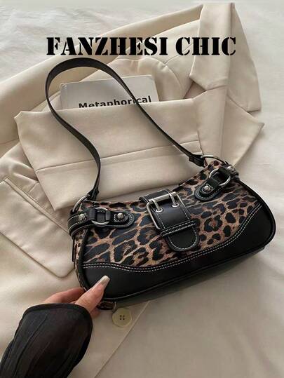 This Bag Features A Wild Leopard Print Collision With Cool Black Leather, Silver Metal Buckles, And White Bright Lines To Outline A Sharp Silhouette. The Wide Shoulder Strap Design Combines Strength And Retro Style, Exuding A Rebellious And Modern Urban Temperament, Suitable For Gatherings, Shopping And Other Occasions.
