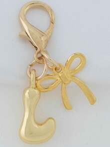 1个A-Z金色泡泡字母可爱吊坠，蝴蝶结装饰，钥匙扣，戒指托，背包挂饰，汽车挂饰，购物，海滩，露营，钱包配饰。适合作为送给女性、朋友和学生的礼物，时尚创意设计，生日礼物装饰，圣诞礼物。 - 金色蝴蝶結 - 查看 5