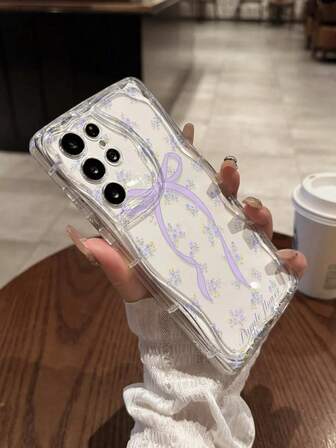 เคสโทรศัพท์ลายดอกไม้สีม่วงใสเนื้อครีมพร้อมโบว์การ์ตูน ป้องกัน สำหรับ Samsung S24/S24 Plus/S24 Ultra, S25/S25 Plus/S25 Ultra, A04, A15, A16, A26, A36, A56, A55, A12, A13, A14, A23, A24, A32, A33, A51, A52, A53, A54, A72, S20 FE, Redmi Series