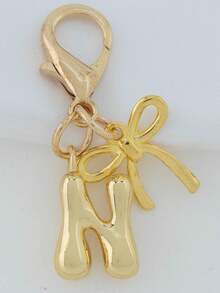 1个A-Z金色泡泡字母可爱吊坠，蝴蝶结装饰，钥匙扣，戒指托，背包挂饰，汽车挂饰，购物，海滩，露营，钱包配饰。适合作为送给女性、朋友和学生的礼物，时尚创意设计，生日礼物装饰，圣诞礼物。 - 金色蝴蝶結 - 查看 6