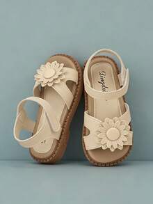 1双米色雏菊装饰软皮女童凉鞋，防滑平底交叉绑带+踝带，甜美清新风格，热门单品，好评如潮，舒适柔软鞋底，理想的儿童假日凉鞋