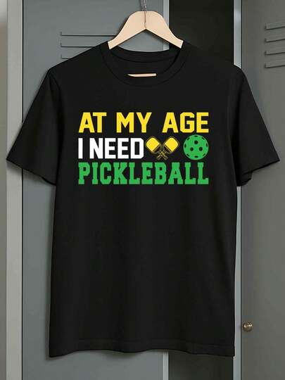 1 Pack Men's Heavyweight Pickleball-Themed T-Shirts - "At My Age I Need Pickleball" Slogan & Paddle/Net Graphics, Casual Short Sleeve Round Neck Tees for Summer, Casual Wear, Church, Independence Day - Machine Washable Black