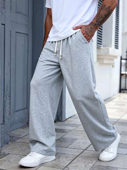男士浅灰色弹力腰阔腿休闲运动裤，采用超柔软透气面料，穿着凉爽舒适，简约时尚设计，适合日常通勤、居家休闲穿着，是送给男士的贴心礼物。