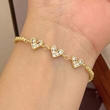 18K镀金铜锆石心形可调节珠链手链，时尚优雅，男女皆宜，适合日常佩戴、约会、节日等场合。