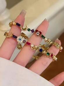 rundraw 一款饰有星星、月亮和闪亮珐琅心形的手镯；热门出口珠宝。 - 彩色 - 查看 5