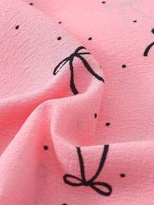 Bộ đồ ngủ nữ 2 món thoải mái với họa tiết chấm bi nhỏ và nơ, gồm áo tay ngắn cài cúc cổ bẻ và quần short có nơ, đồ ngủ và đồ mặc nhà thoải mái cho mùa hè. - Hồng - Xem 8