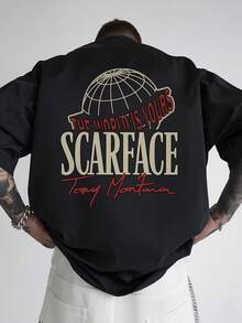 Camiseta de Estilo Urbano 'EL MUNDO ES TUYO' con Diseño de  - Camiseta Negra de Manga Corta con Gráficos Impactantes y Texto Rojo Curvado - Ideal para Fans de Tony Montana y Amantes de la Moda - Ropa Casual y de  para Hombres Modernos - Negro - Ver 1