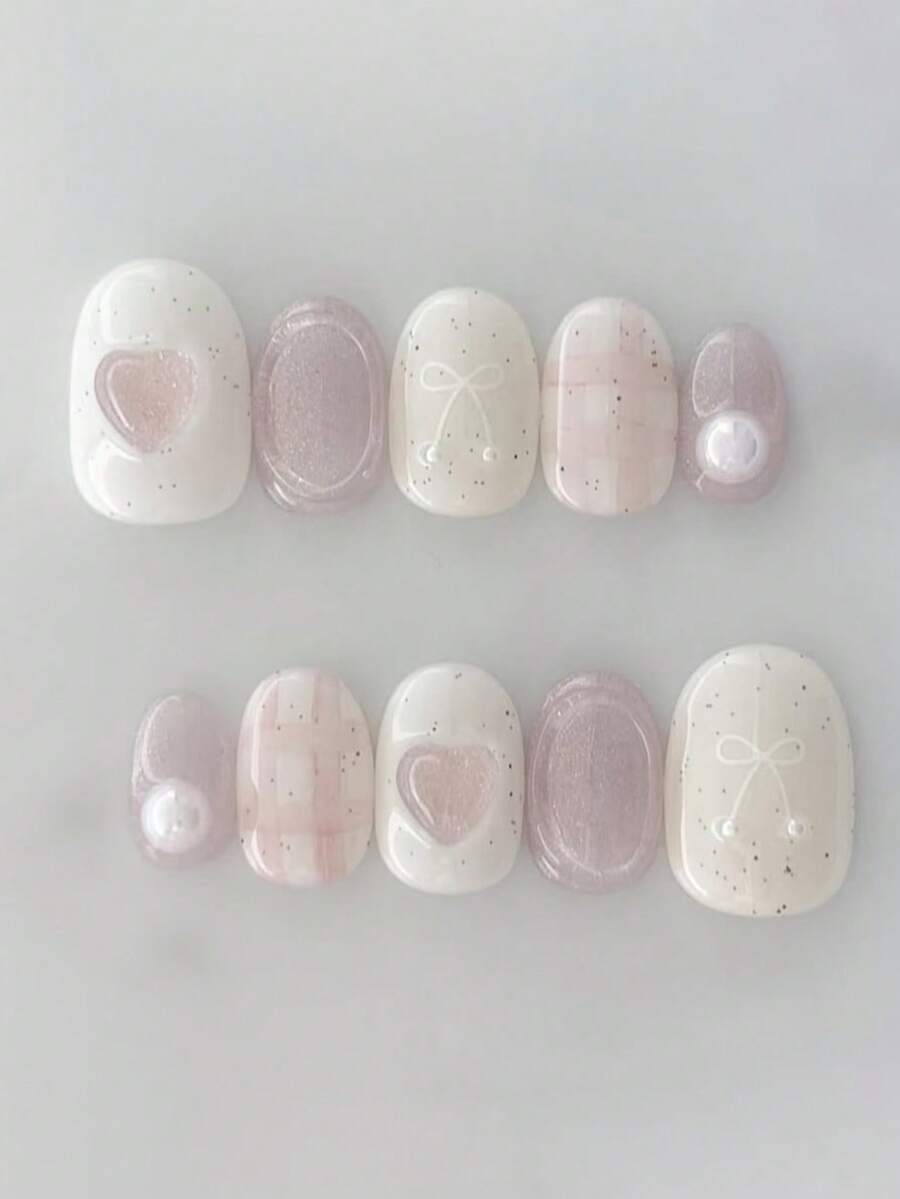 10片手工制作的按压式美甲贴纸，短椭圆形，粉白配色，清新可爱风格，白色底色搭配浅粉色猫眼闪粉，手绘蝴蝶结和格子图案，3D爱心设计，简约优雅的按压式美甲贴纸，适合女性和女孩，春、夏、秋、冬四季皆宜，适合派对和日常佩戴。 - 粉色 - 查看 1