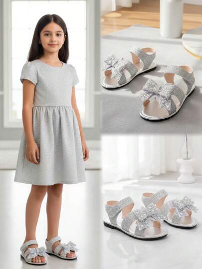 1双银色加大码女童平底凉鞋，柔软舒适的纯色皮革，饰有亮片、珍珠和蝴蝶结，圆头露趾防滑时尚公主沙滩凉鞋，适合3-12岁女孩，日常、度假、上学、派对等场合穿着，2026春夏款。