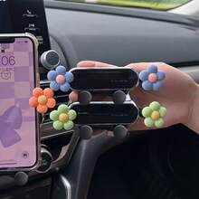 A Mobile Phone Holder For That Features A Daisy Design With Five Petals, Serving As Both A Navigation Aid And An Interior Air Vent Decoration
