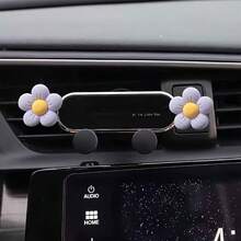 A Mobile Phone Holder For That Features A Daisy Design With Five Petals, Serving As Both A Navigation Aid And An Interior Air Vent Decoration