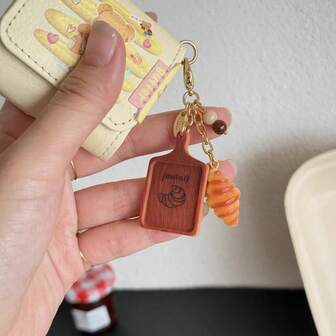 Sött realistiskt brödhänge i form, croissant-kaffekopphänge, mini-matleksak med bröd och tårta, hartskräm, gör-det-själv-tillbehör, kaffebrödset med myntbörshänge, lämplig för väskflik, dragkedja, telefonkedja, hörlurar, anteckningsbokshänge, ryggsäck, plånbok, nyckel, väskkedja, väskdekoration, nyckelring, väsktillbehör, festpresenter, små bakpresenter