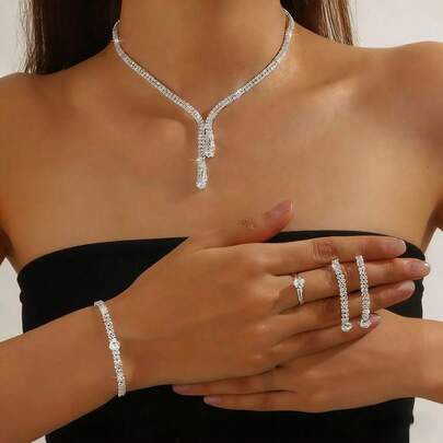 A Set Of Women's Jewelry, A Silver Ensemble, A Stunning Pearl And Gemstone-Adorned Wedding Gown, And A Collection Of Western Crystal Accessories Suitable For Everyday Wear And Various Party Occasions.